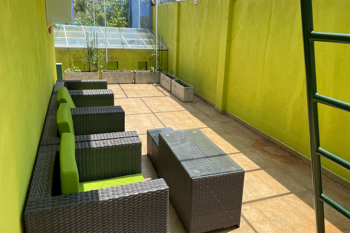 Villa exterior surrounded by lush greenery and tropical landscaping