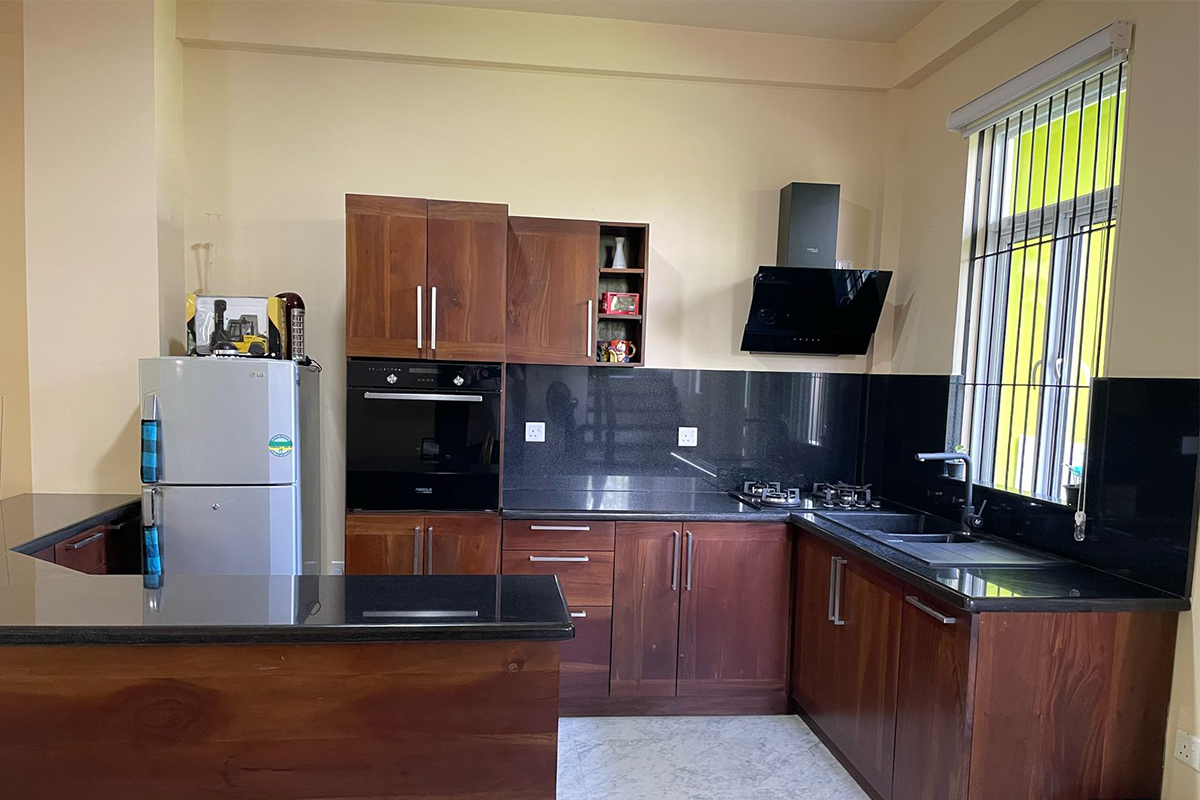 Fully equipped modern kitchen with appliances and ample storage space